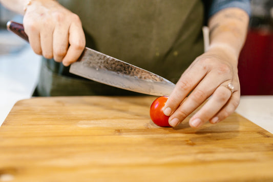 Chef Knife Buying Guide - Knife Cutting Tomato